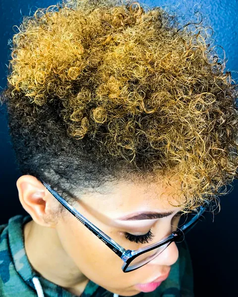 Short blonde curls with visible dimension and texture