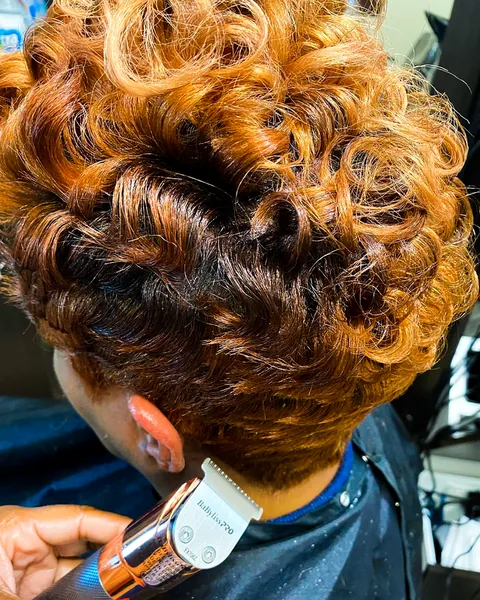 Close view of warm toned curls in a short hairstyle